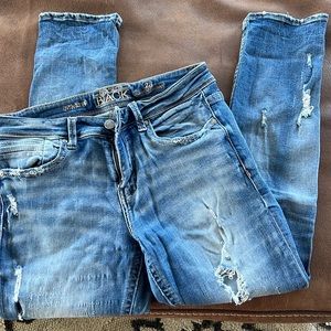 Distressed buckle jeans